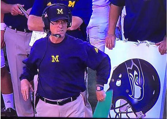 SeaTimesSports's tweet image. Looks like Jim Harbaugh might still be thinking Seahawks in his college coaching debut. seati.ms/1INF41Q