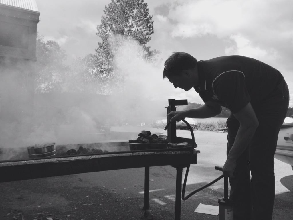 Men's Coach Aalbert in a perfectly smokey silhouette as he starts the flames for the Captains BBQ. #Mmmmmmm ”