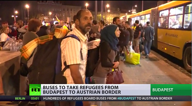 RT_com's tweet photo. UPDATE: Hungarian buses carrying refugees are arriving at Austrian border http://t.co/yT5no7WWwN http://t.co/aWj4OWEoHI
