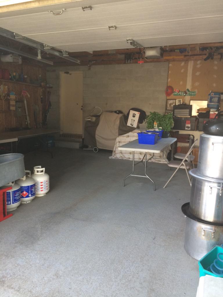 Garage set for tomato jarring Sunday a.m.  #6bushels #accordianmusic#coldbeer