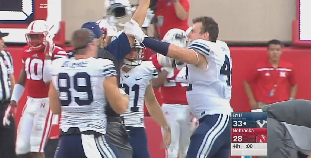 SportsCenter's tweet photo. Unbelievable! BYU beats Nebraska on a last second Hail Mary, 33-28. http://t.co/jKo82OSR5M