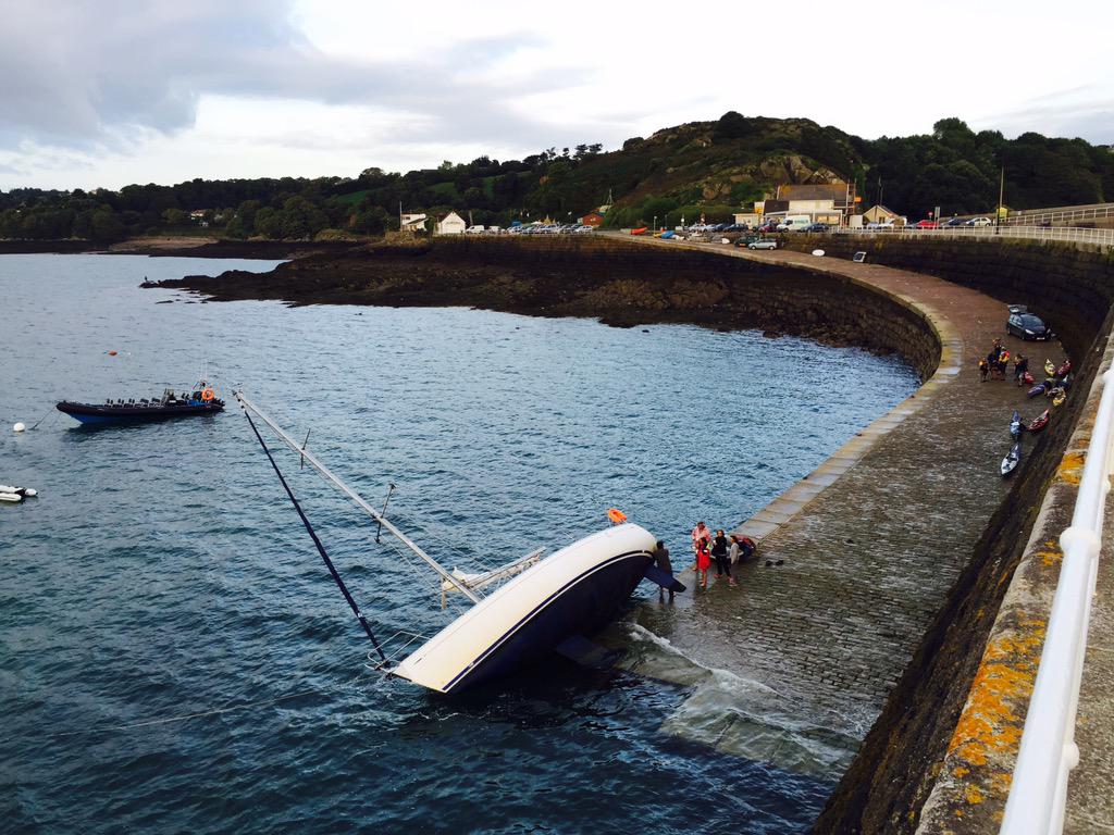 Hi Drama at St Catherine this morning. A French yacht has come off its mooring and dried out on the slip.