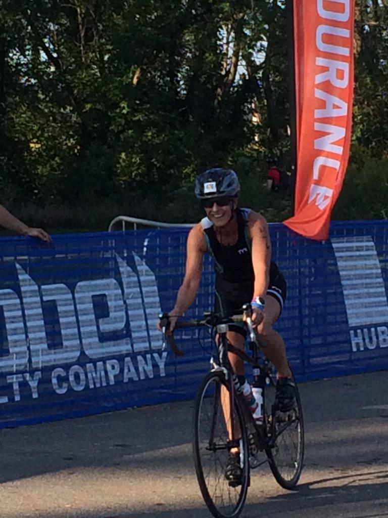 ToddSchweizer's tweet photo. Out of the water in 48min.  On the bike and out the chute.  Toughest part down. Go Girl! http://t.co/0R8UmFJbPU