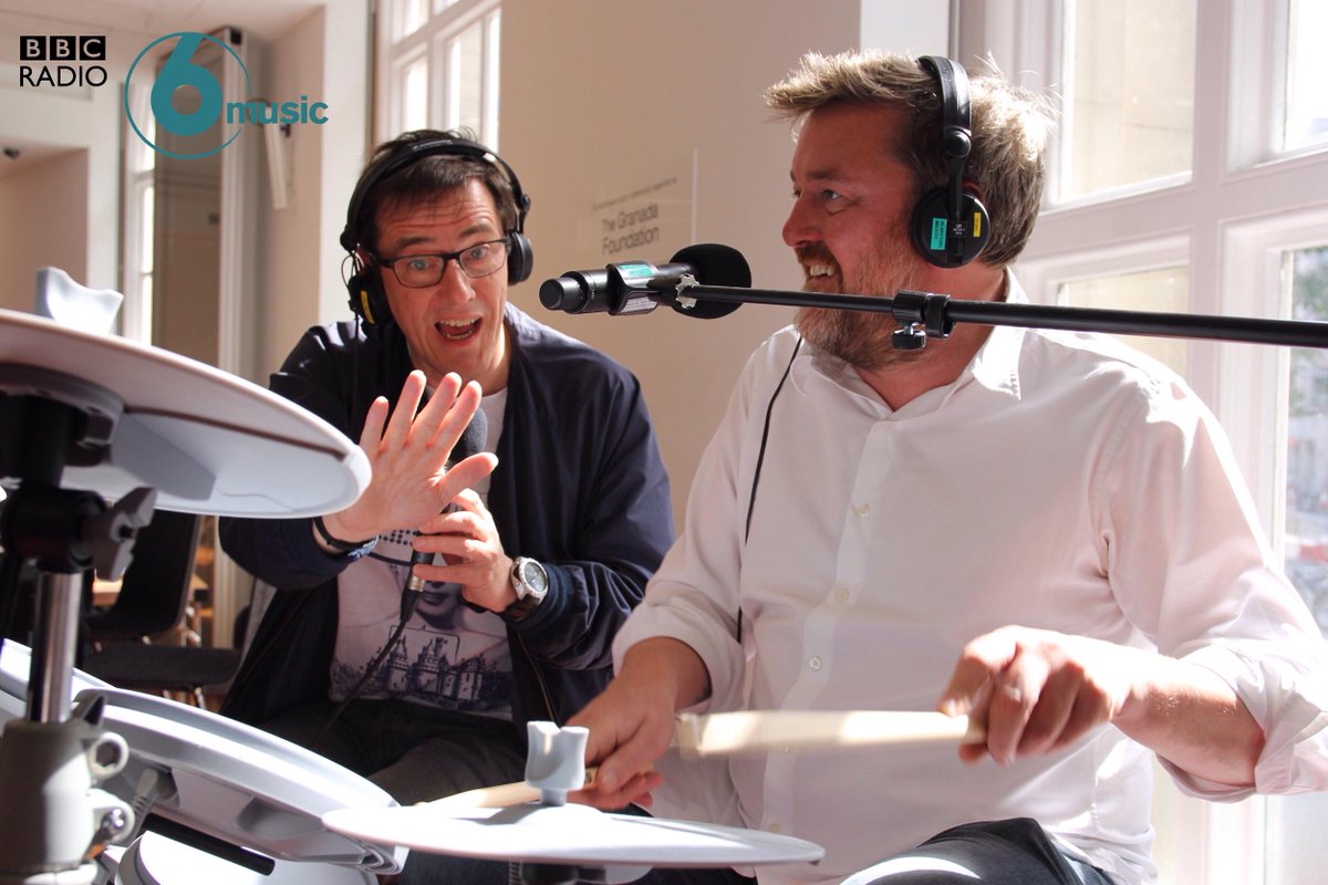 BBC6Music's tweet photo. .@Guy_Garvey getting his second drum lesson courtesy of none other than Stephen Morris of @neworder #6MusicLibraries http://t.co/xk3AaIRlDW