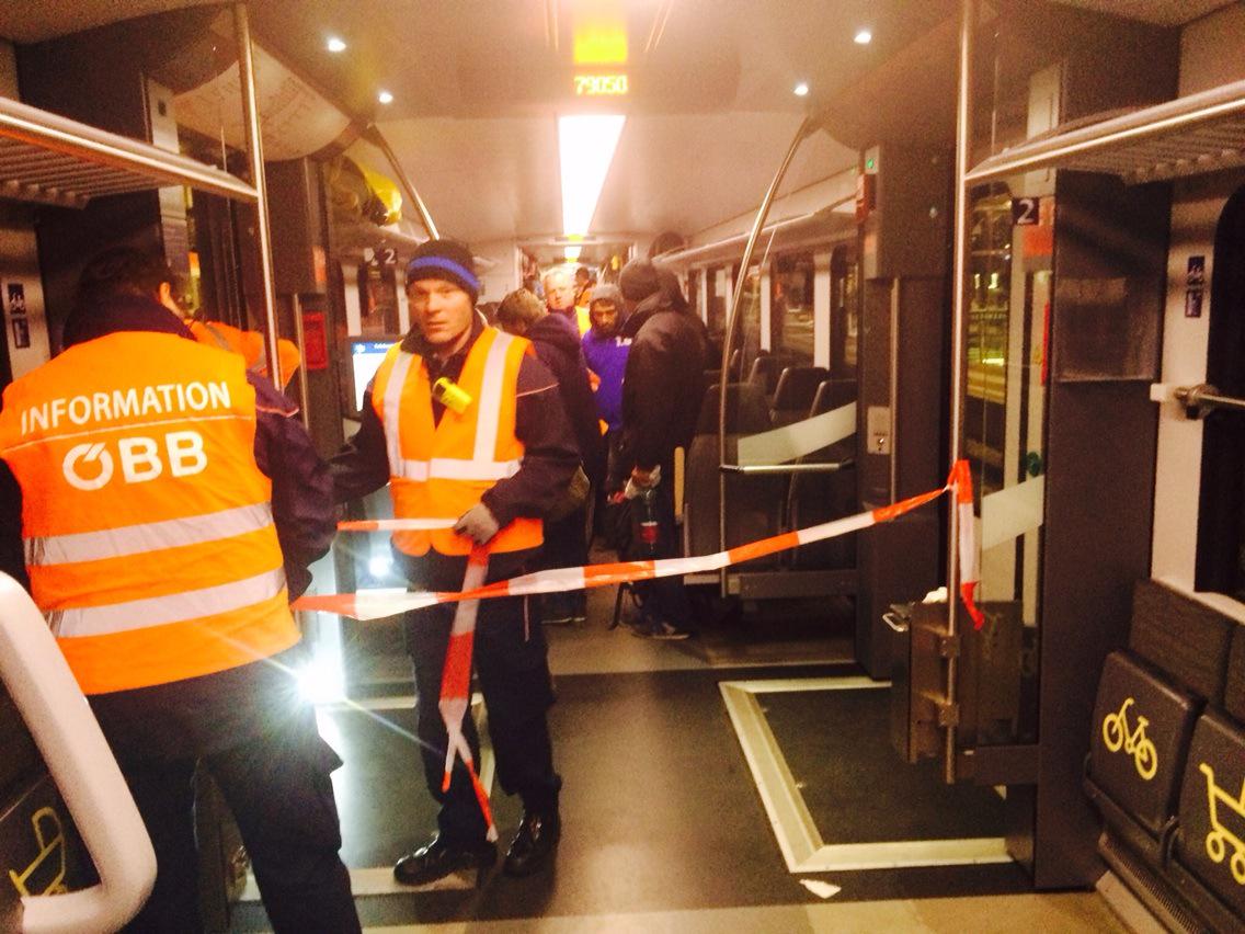 Am travelling to Munich on this train - guards put up tape to separate refugees from other passengers #refugeecrisis