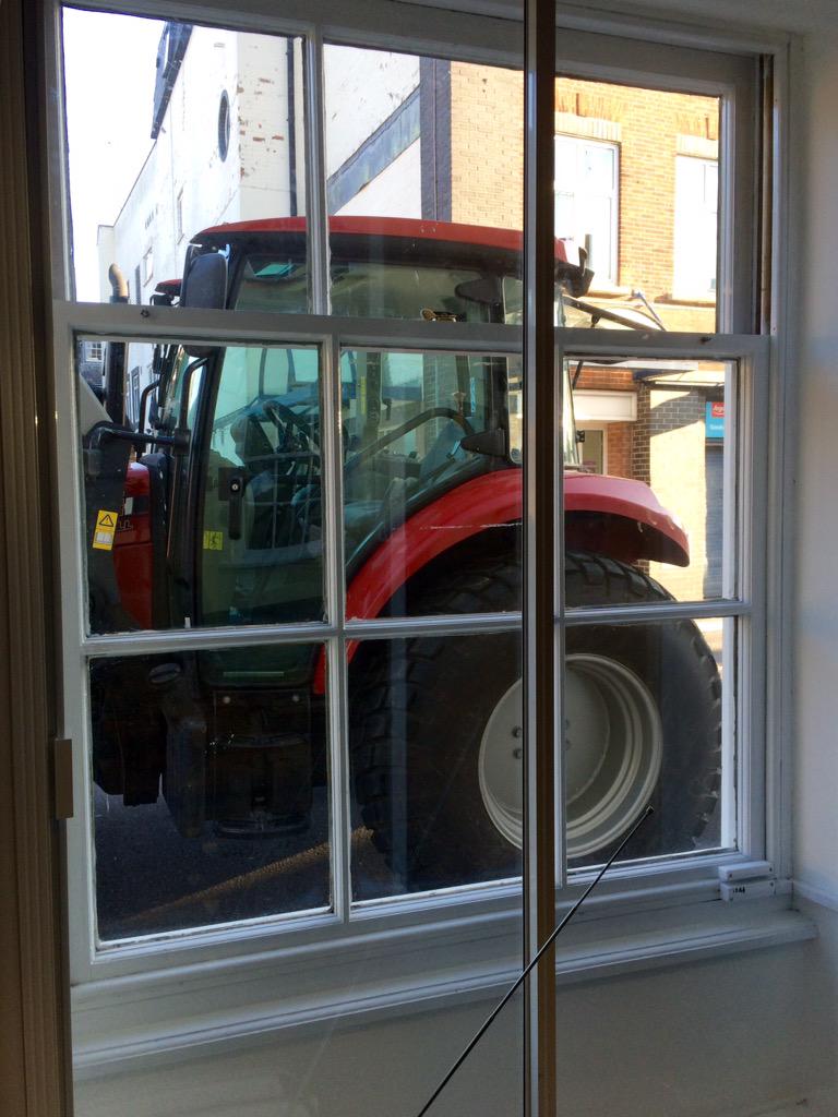 CharlotteFoot's tweet photo. A tractor has decided to take up residence outside @BBCRadioSolent's studios in #Dorchester. #travel #onlyinDorset http://t.co/yxWINhMzwO