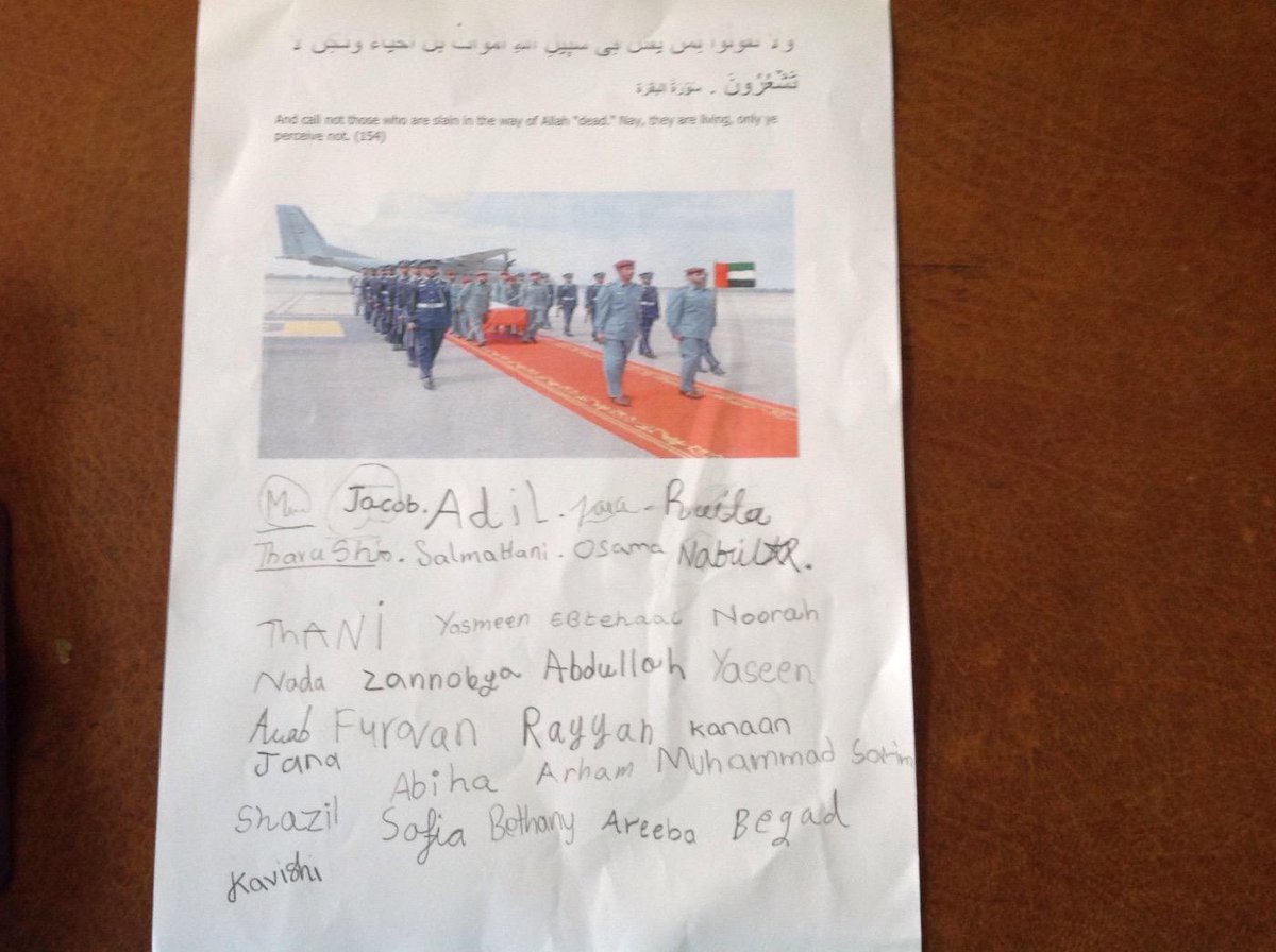 Nusrath1976's tweet photo. Students of Year 3K pay their respects to the Martyrs of UAE #twscondoles_martyrs @official_TWS http://t.co/5YVkXmU4zs
