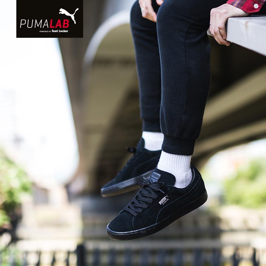 puma suede black and white on feet