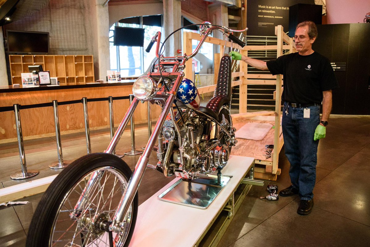 IvanAvdeevP's tweet photo. New on view: the "Captain America" chopper from Easy Rider! Here's a peek at our installation process. #omgEMP http://t.co/CRhiry8uH9