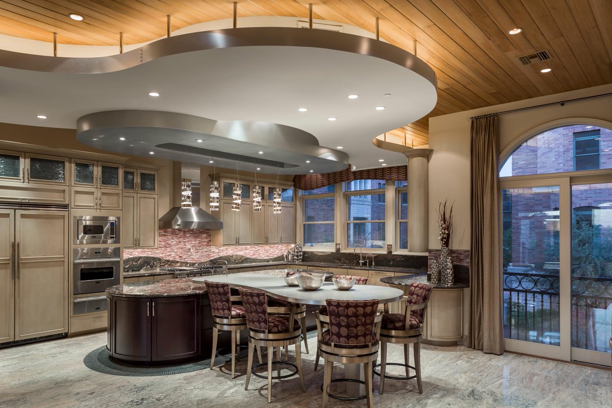 estestinc's tweet photo. The #ChateauOnCentral kitchen features repetition in the curves of the ceiling, islands, backsplash, &amp; cornice. http://t.co/2DATF4rw87