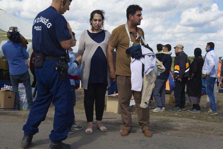 UNrefugees's tweet photo. Najibah, 7 months pregnant, walked for 8 days to get to #Hungary #europecrisis http://t.co/JgJDq7CWlO http://t.co/pBjSkWMtXB