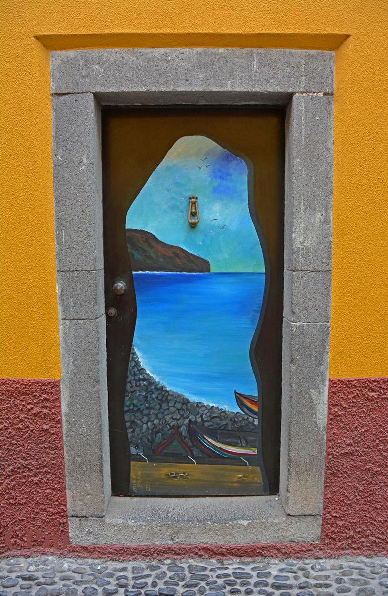 GenteTV_Cesar's tweet photo. Creative artwork on various doors in the old section of downtown Funchal city in Madeira island. http://t.co/gcK3pIcHSz
