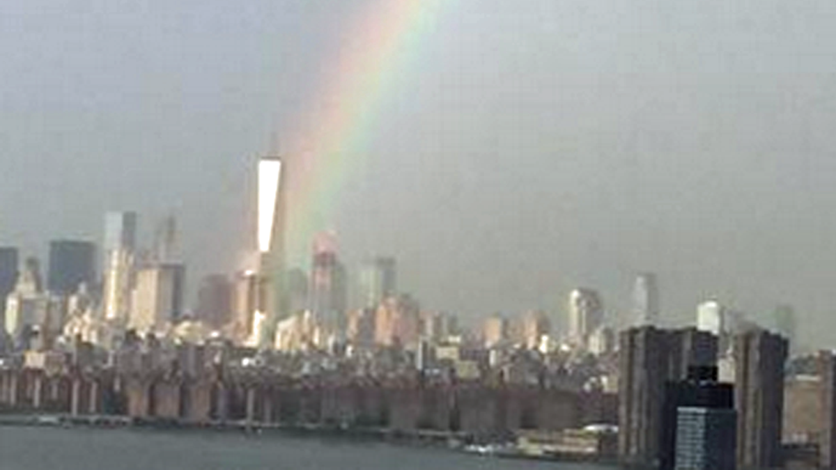 NBCNewYork's tweet photo. Story behind incredible photo by @leverageagency of rainbow appearing over WTC on eve of 9/11 http://t.co/d8FgC0jdyK http://t.co/bjCKKhnJth