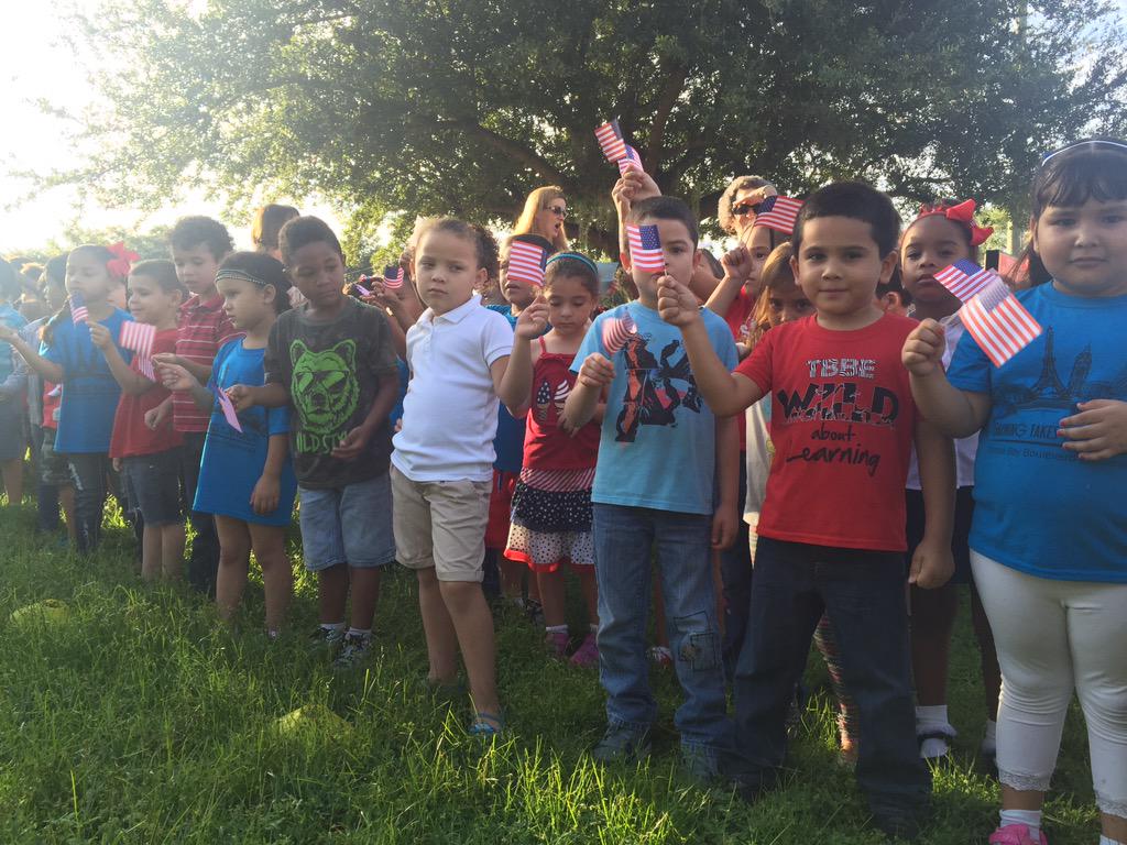 ChrisDayWTSP's tweet photo. Tampa Blvd Elementary students showing their patriotism (and maybe restlessness) as 9/11 ceremony gets underway #WTSP http://t.co/10F8PseRoh