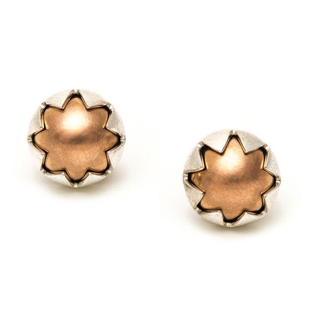 A pair of sunny, rose gold starbursts to brighten your visage! Vicky Mason's Domed Corona earrings ($490). Visit eg…