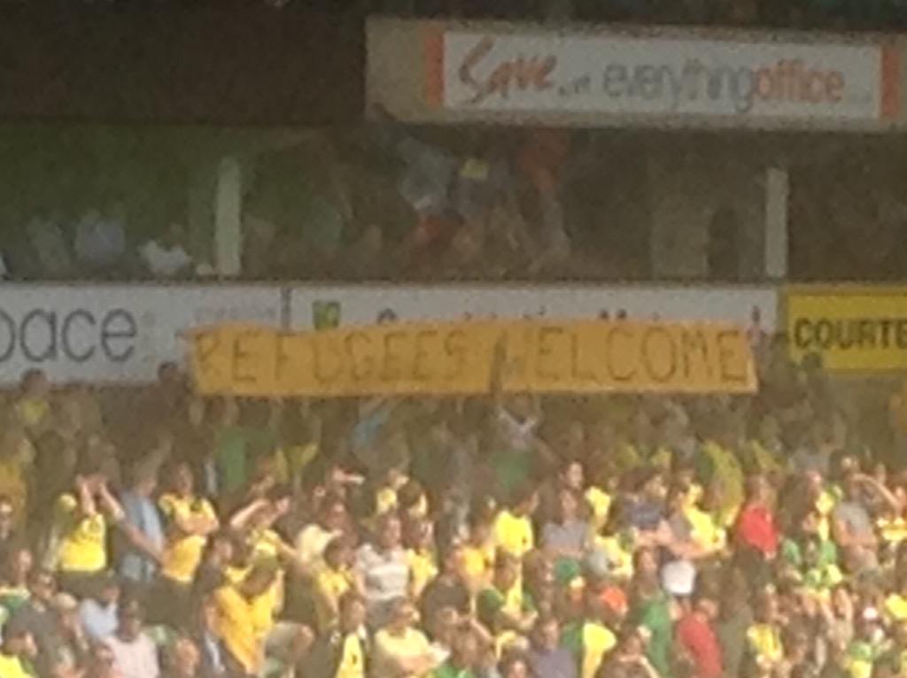 marcwebber's tweet image. Refugees Welcome banner on display at Carrow Road. #Ncfc #afcb #bbcfootball #bpl