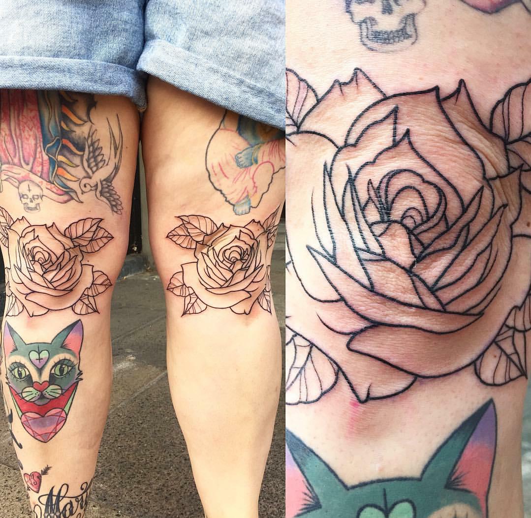 Matching pop art rose tattoos on both knees