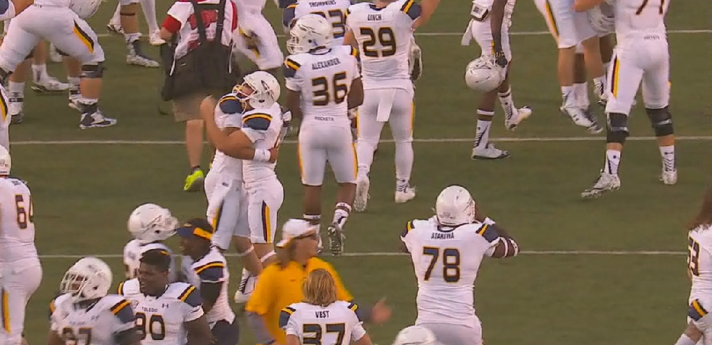 SportsCenter's tweet photo. The upset is complete! Toledo takes down No. 18 Arkansas for their 1st ever win over an AP Top 25 team on the road. http://t.co/ORBcnyXxF0