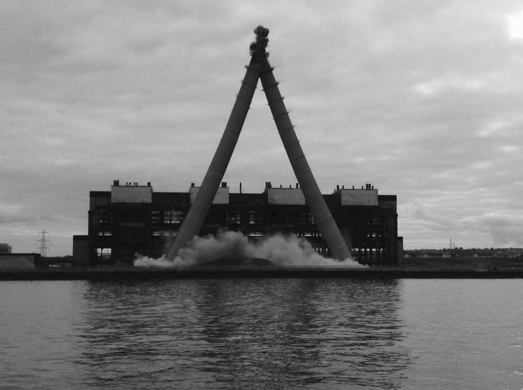ScottishPower's tweet photo. End of an era as #Cockenzie's 149m chimneys are brought to the ground. #ChimDem http://t.co/PLMl4OkFb9