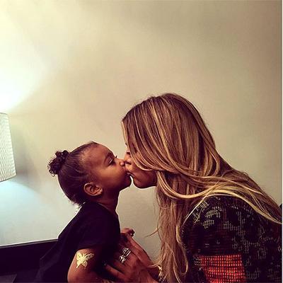 MerkelsBeauty's tweet photo. North West and Auntie Khloé ‘KoKo’ Kardashian Share a Sweet Smooch via http://t.co/YcnmPbwzmH http://t.co/JXY6KZAlZe http://t.co/SKHbFQGIRK