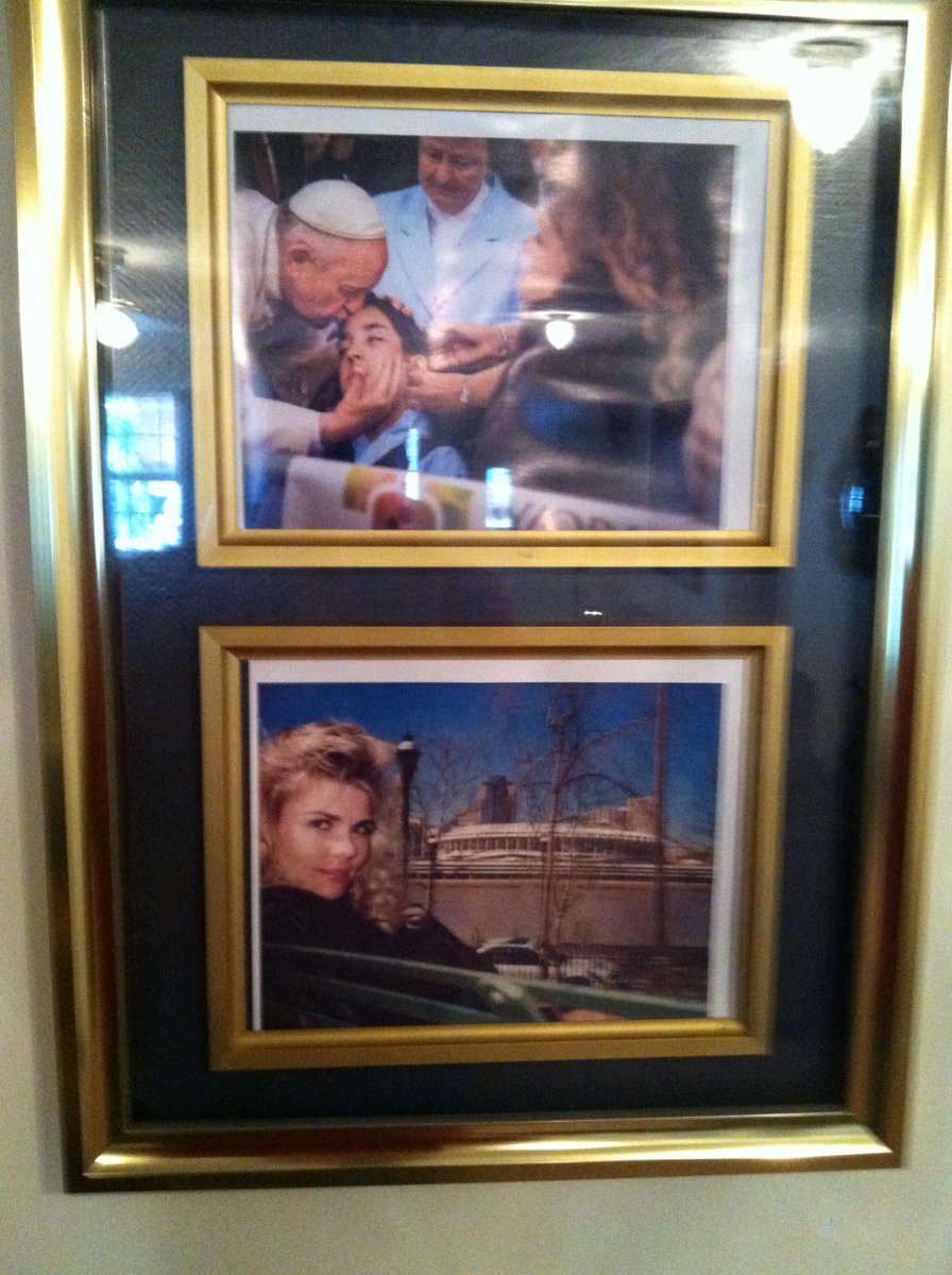 We were so moved by this image, we printed the photo and is now hanging in our living room! God Bless our Pope!