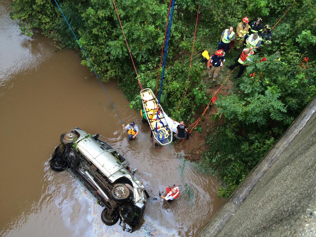 FahertyWSOC9's tweet photo. They're lowering the basket down now.   Told driver was trapped after going off highway 321. http://t.co/o2uJocrMxJ