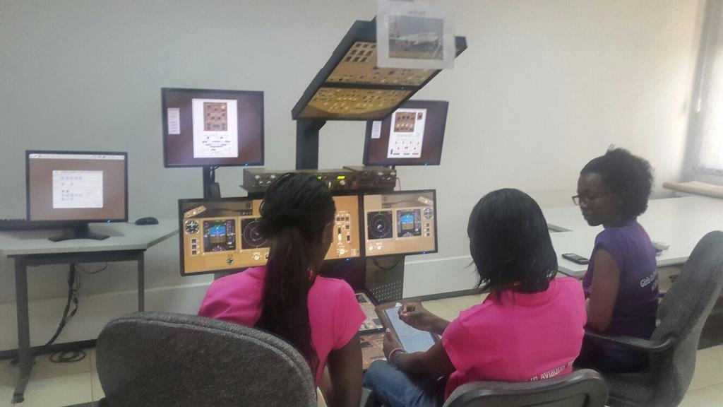 WAI_Kenya's tweet photo. Capt.Mary Kai of @KenyaAirways taking some ladies through a #B777 sim during #GIAD
#WAIKenyaChapter http://t.co/ltT8UN9b4I