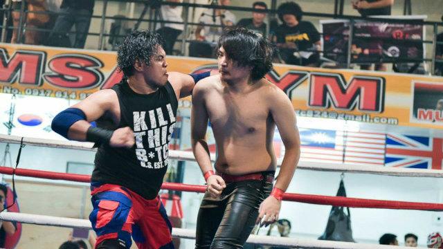 rapplerdotcom's tweet photo. WATCH: Filipino wrestler sets hand on fire, chops opponent's chest http://t.co/tUHSO453cp http://t.co/6cSEFdt28g