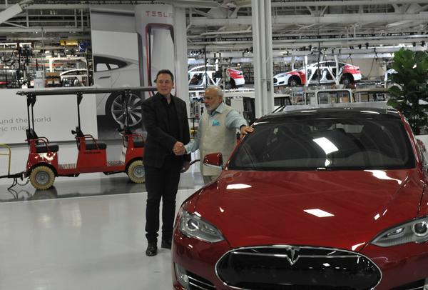 Tesla's tweet photo. RT @narendramodi Thanks Elon for showing me around. Enjoyed discussion on how battery technology can help farmers http://t.co/XbNNPfZoQu