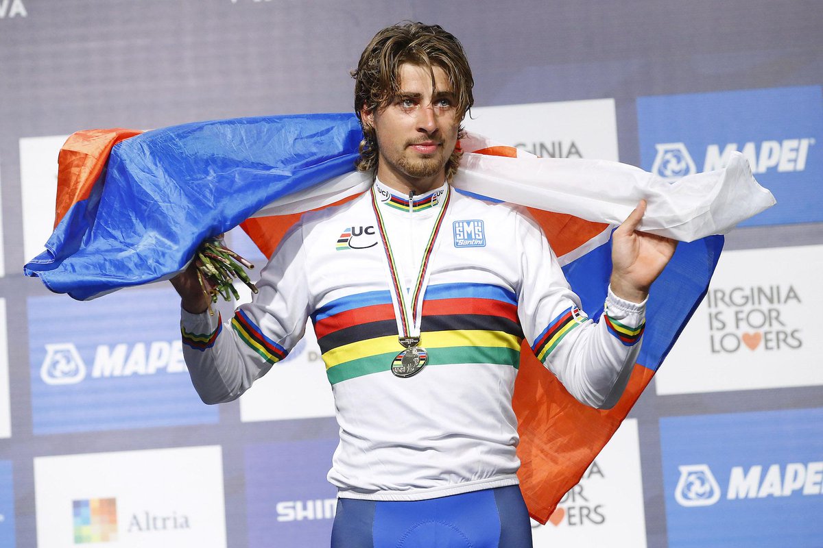 tinkoff_team's tweet image. What a sight!!! @petosagan pulls on the rainbow stripes! #Richmond2015 #TinkoffSaxo #WorldChampion