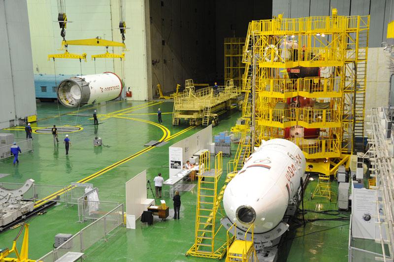 ShuttleAlmanac's tweet photo. New Pic - Russian #ProgressM28M is off to be stacked on its Soyuz. To launch Oct 1. Note #SoyuzTMA19M in scaffolding. http://t.co/Hklc8DpzCQ