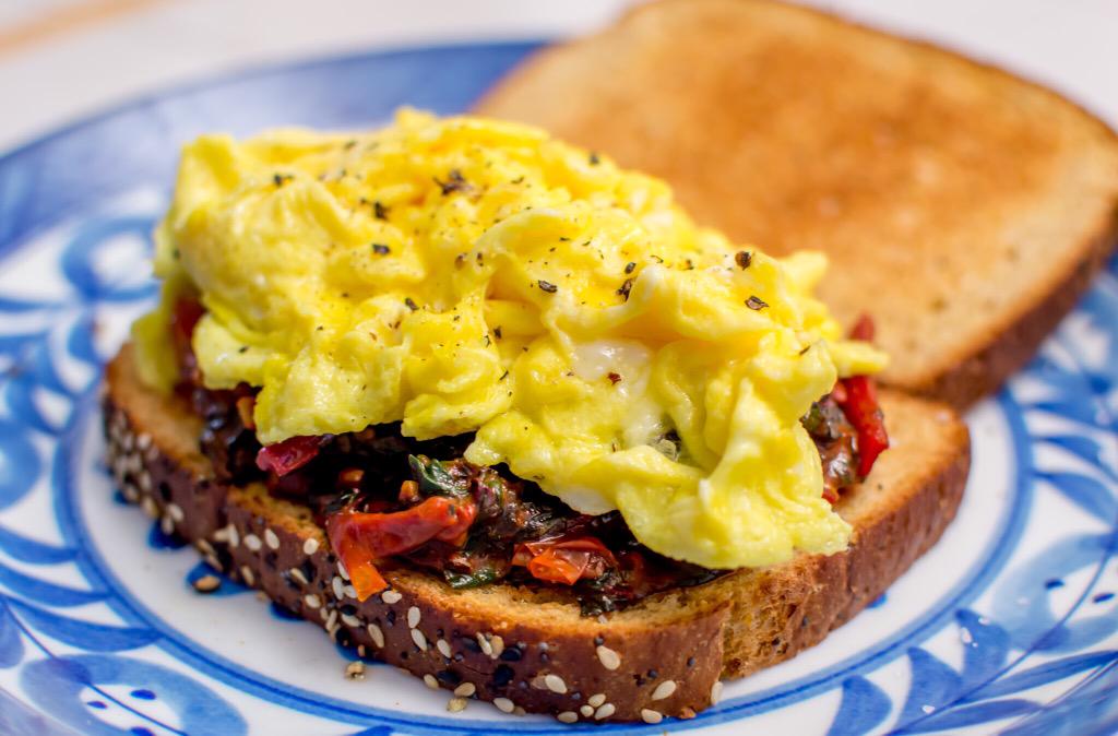 #Breakfast Scrambled eggs on wheat toast
+ braised rainbow chard &amp; tomatoes 
Eggs &amp; produce from Bloomfield Organics