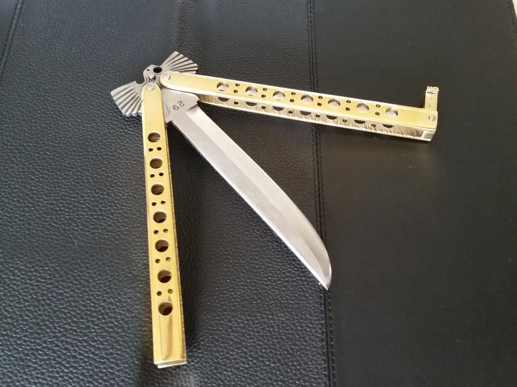 SilatSquad's tweet photo. Filipino Eagle Copper Channel Balisong. Made in Taal City, Phillipines http://t.co/tTwaq5pCcY