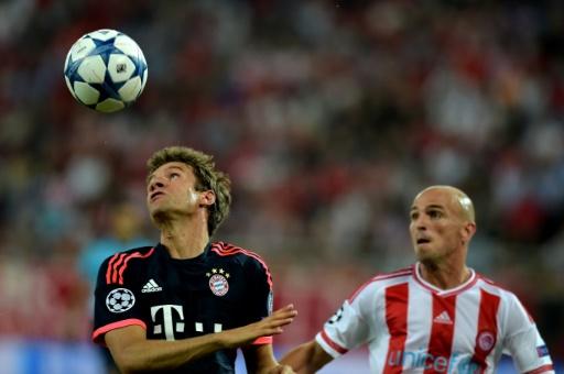 worldsoccertalk's tweet photo. Olympiacos 0-3 Bayern Munich: Two Mueller goals lift German champions [VIDEO] http://t.co/1uvnIfEcl9 http://t.co/m9EWDwprSM