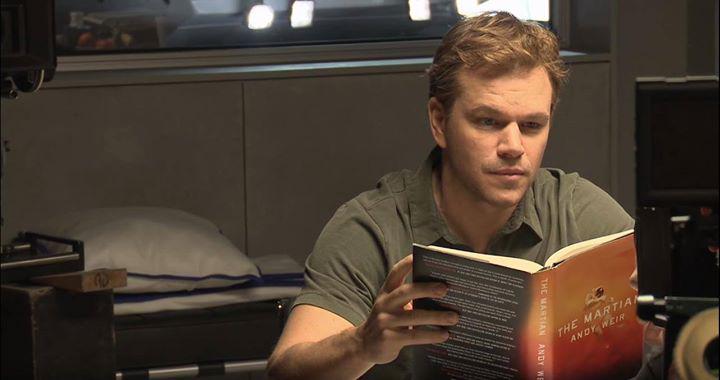 andyweirauthor's tweet photo. The Martian reading The Martian on the set of The Martian http://t.co/MOyIniFtja