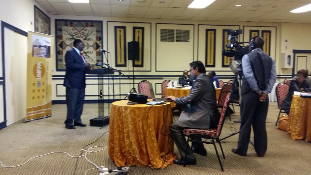 UNFPA_Lesotho's tweet photo. @GeoffreyOkumu4 explains the importance of the #SDGs for Lesotho to media: 'MMR Lesotho has to reduce to 70/100.000' http://t.co/hhsEnX1hfY