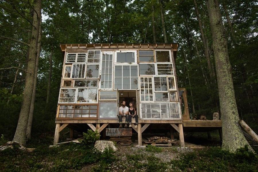 This has to be a an impressive use of up-cycling...the front of a cabin made from old windows.