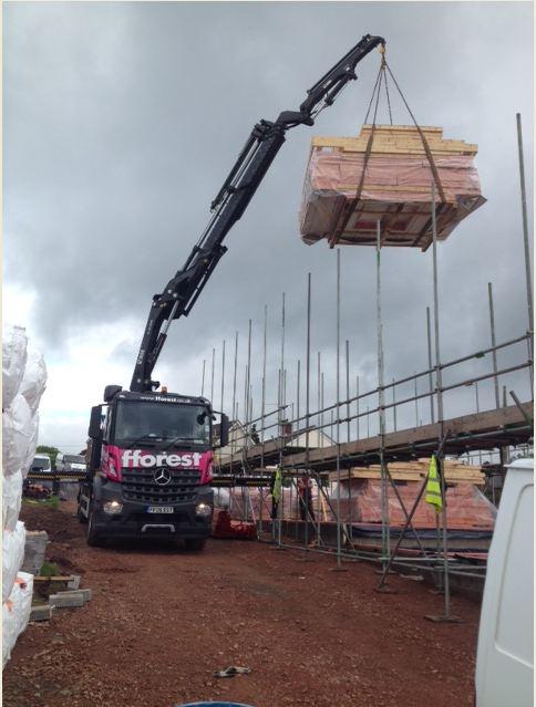 FforestTimber's tweet photo. #Frame first floor panels arriving for #Capsel Limited site in #ShireNewtown. Installation by the #Fforest fixingTeam http://t.co/8Iyv8BjaI2