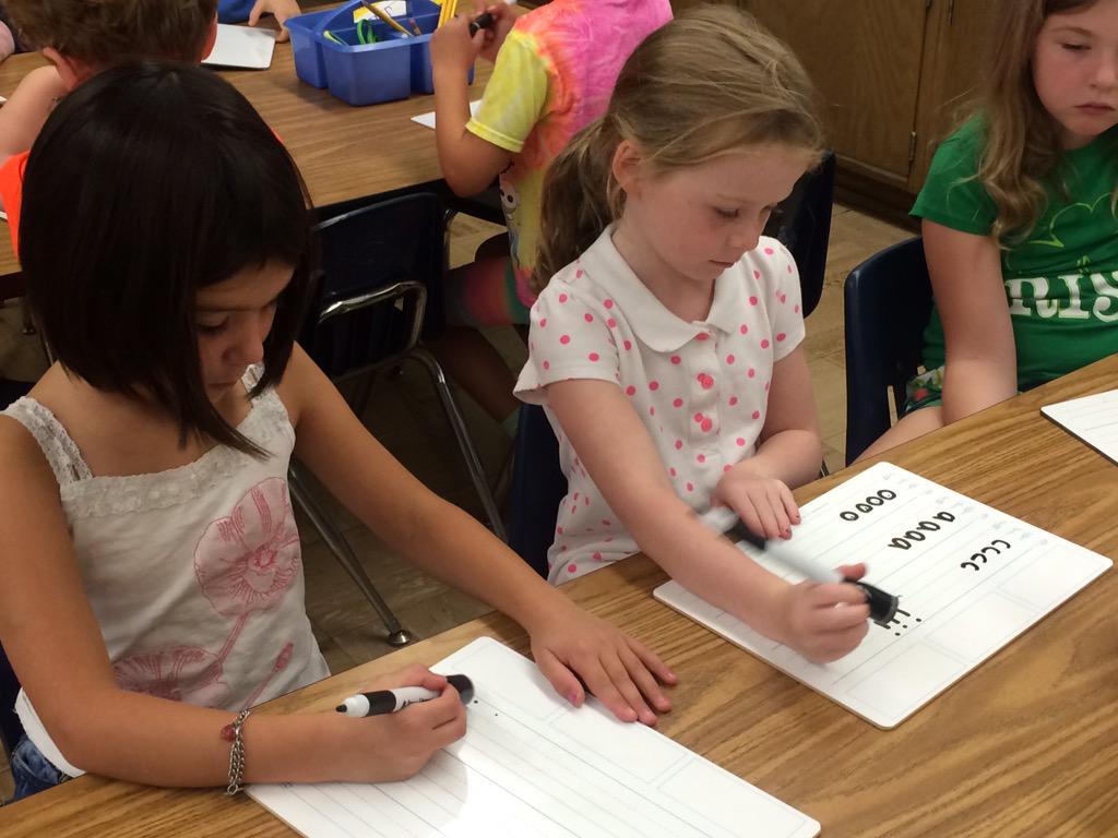 WOSnews's tweet image. #mrslukeWOS&apos;s student leads the class with their #fundations drill sounds before practicing letter formations