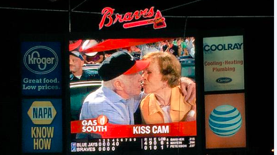 espn's tweet photo. Former president Jimmy Carter, battling cancer, gave his wife a smooch on the @Braves' Kiss Cam. (via @TasMelas) http://t.co/PHy96hUv1y