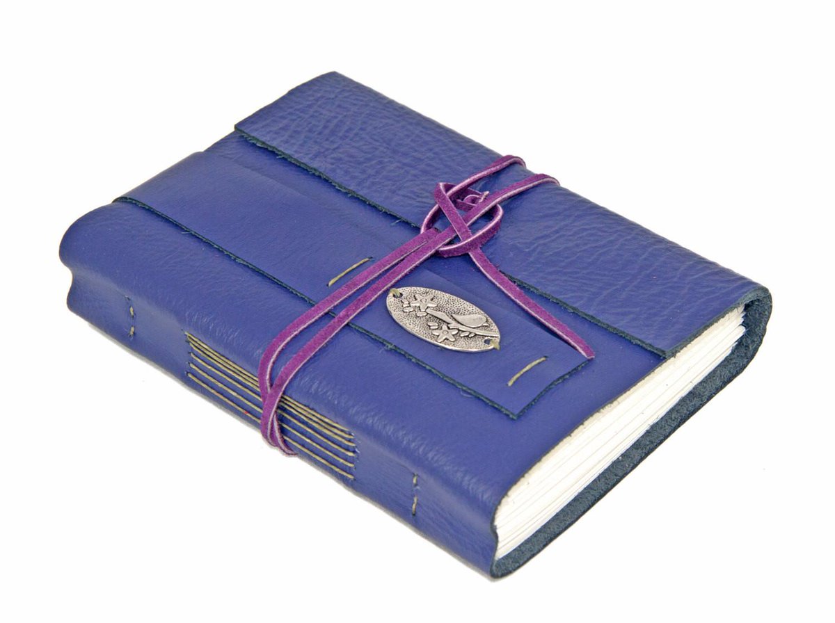 BoundByHandUS's tweet photo. Purple Leather Wrap Journal with Bird Charm and Bookmark http://t.co/RfRKVtccqF #boundbyhand #DreamNotebook http://t.co/BY4A9FHEFV