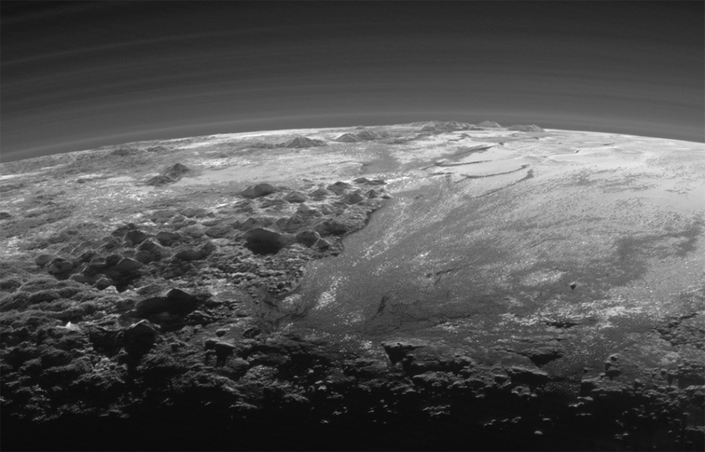 NatGeo's tweet photo. Stunning new photos from @NASA's New Horizons spacecraft show an eerie Pluto at dusk: http://t.co/4XNRjEcmJ9 http://t.co/ouW1yStIF5