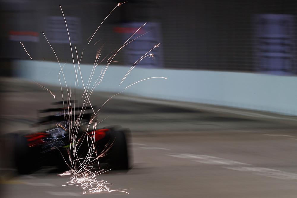 McLarenF1's tweet photo. Think we can see why this #F1NightRace is so popular. Mega spark shot there. http://t.co/MSzdgA6eb3