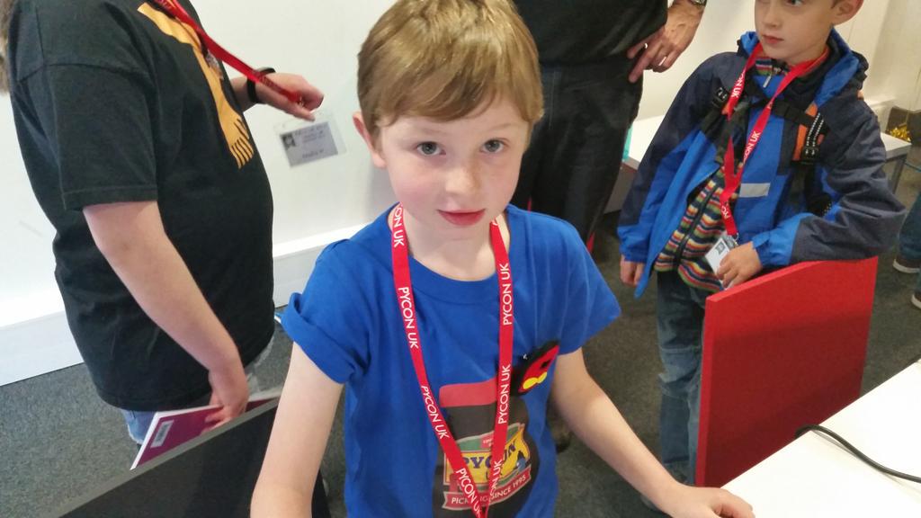 stewartwatkiss's tweet image. My kids showing off their new #codebug interactive badges at @PyConUK