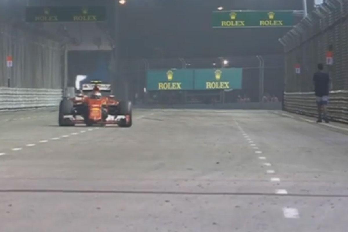 NewshubSport's tweet photo. WATCH - A man managed to wander onto the track mid-race during the Singapore GP: http://t.co/i9SlQrFzZf http://t.co/PcVACqq7hy