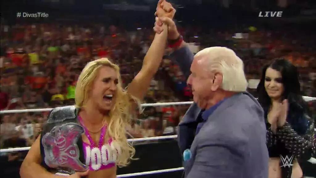 DavideCuccuru's tweet photo. @MsCharlotteWWE wins the #DivasTitle agains @BellaTwins http://t.co/dxWYfxECXy