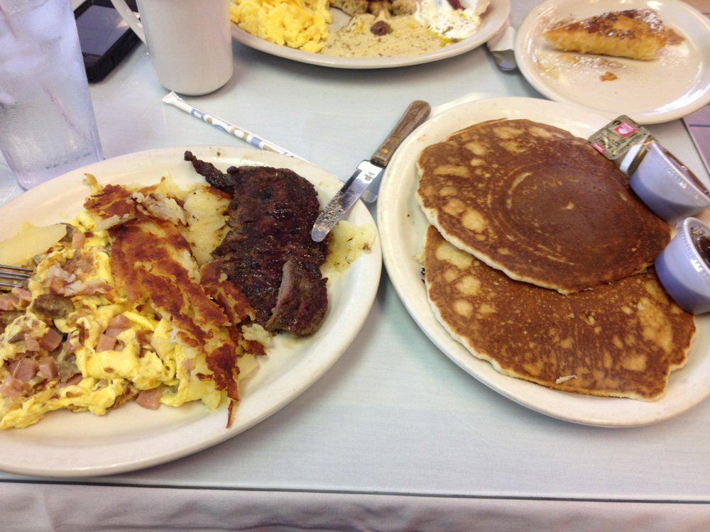 Start your day in a big way w The Big Boy Breakfast. Eggs w bacon, sausage, smoked ham, pancakes, home fries + steak.