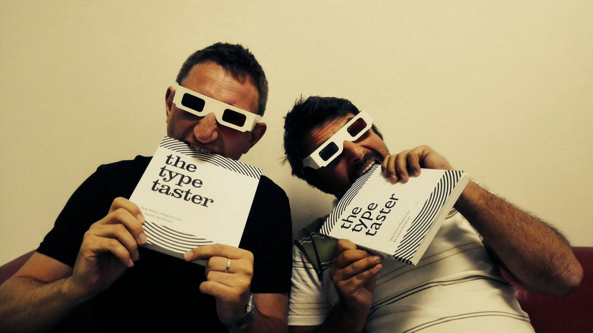 TypeTasting's tweet photo. Great photo of type tasters @jakubrendla and @ufoslav tucking in to their copies of the book. #TheTypeTaster #book http://t.co/xw4eUTRVng