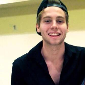 adoreaboutluke's tweet photo. luke wearing this shirt it showed off his collarbones so well, i need to start a petition for him to wear it again http://t.co/SFCJRqlXRy
