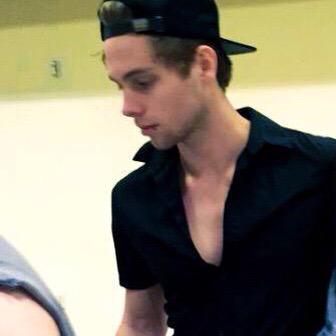 adoreaboutluke's tweet photo. luke wearing this shirt it showed off his collarbones so well, i need to start a petition for him to wear it again http://t.co/SFCJRqlXRy